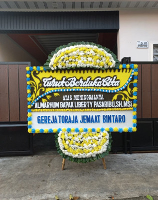 Papan Bunga Duka di Paal Merah